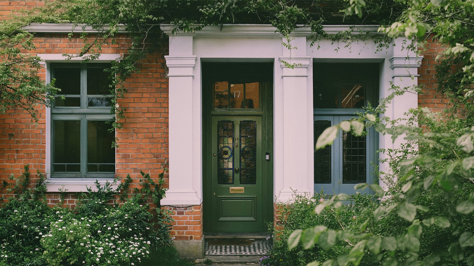 A green Victorian front door of a Yorkshire home